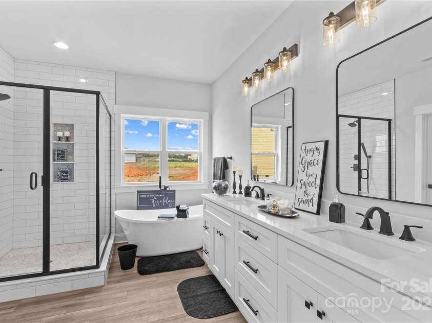 1260 Coppergate Drive, Salisbury, NC 28147.  MLS# CAR4273258, YatesRealty ID 32053. Spa like main Bath with quartz vanities.