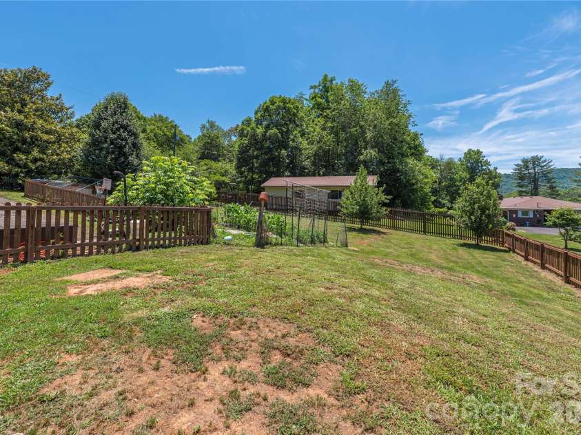 99 Young Drive, Candler, NC 28715.  MLS# CAR4388636, YatesRealty ID 32054. 