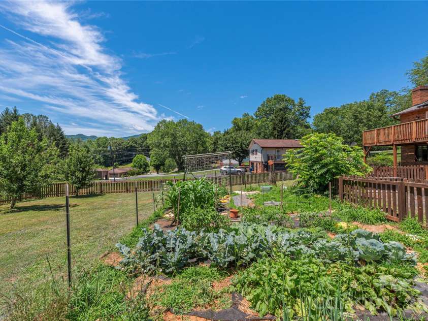 99 Young Drive, Candler, NC 28715.  MLS# CAR4388636, YatesRealty ID 32054. Grow your own veggies