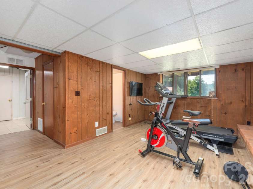 99 Young Drive, Candler, NC 28715.  MLS# CAR4388636, YatesRealty ID 32054. Huge daylight lower level