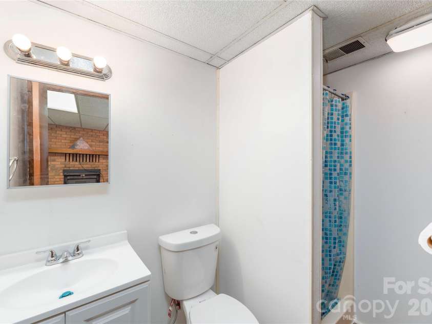 99 Young Drive, Candler, NC 28715.  MLS# CAR4388636, YatesRealty ID 32054. Lover level full bath