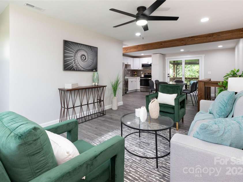 3 High Meadow Road, Asheville, NC 28803.  MLS# CAR4257892, YatesRealty ID 32055. Living room flows into dining and kitchen