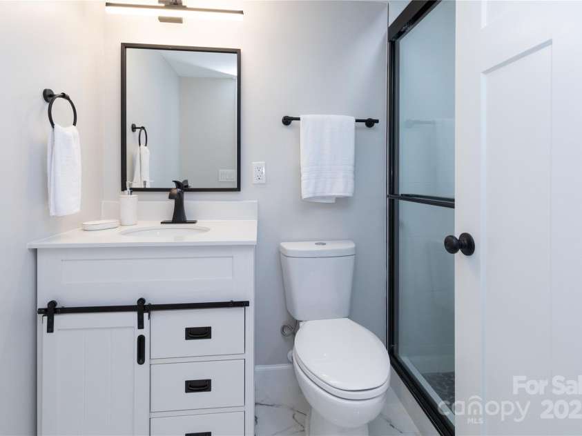 3 High Meadow Road, Asheville, NC 28803.  MLS# CAR4257892, YatesRealty ID 32055. Lower level bath