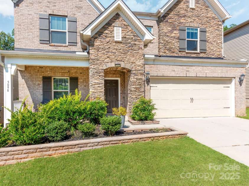 5098 Burnwald Court, Fort Mill, SC 29715.  MLS# CAR4284433, YatesRealty ID 32056. Beautiful Brick Home with a private wood setting in backyard!