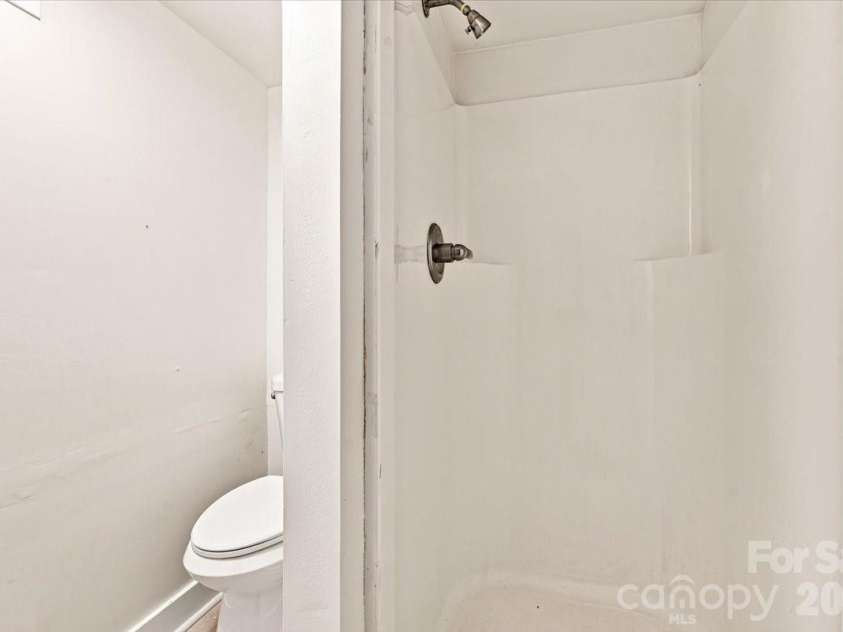 308 Browntown Road, Leicester, NC 28748.  MLS# CAR4419572, YatesRealty ID 32061. Basement Bathroom