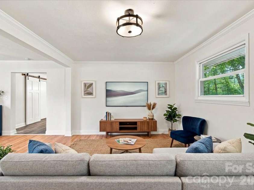 308 Browntown Road, Leicester, NC 28748.  MLS# CAR4419572, YatesRealty ID 32061. Photo Virtually Stagged ( living room)