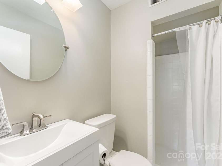 4014 Sulkirk Road, Charlotte, NC 28210.  MLS# CAR4286808, YatesRealty ID 32061. Downstairs bathroom