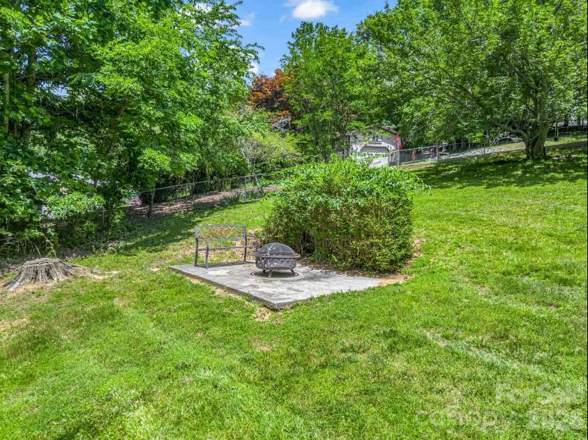35 Chastain Hill Road, Mills River, NC 28759.  MLS# CAR4388520, YatesRealty ID 32063. Back yard, with fire pit
