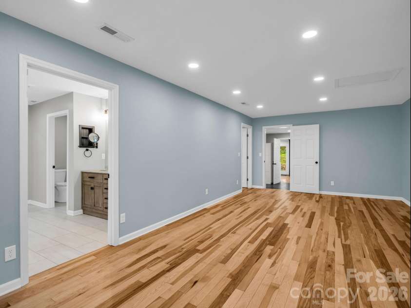 35 Chastain Hill Road, Mills River, NC 28759.  MLS# CAR4388520, YatesRealty ID 32063. Primary Bedroom Suite, with spa-inspired bath & dedicated office/private den