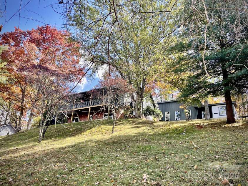 218 Hamlet Drive, Burnsville, NC 28714.  MLS# CAR4265948, YatesRealty ID 32067. Home perched above driveway