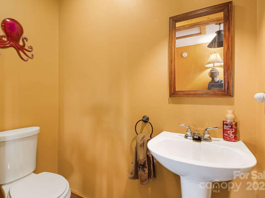 61 Turtle Rock Lane, Tuckasegee, NC 28783.  MLS# CAR4227707, YatesRealty ID 3208. Hall half bath