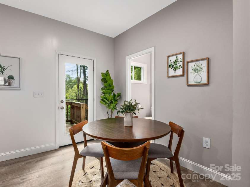 111 Mears Ridge Drive, Asheville, NC 28806.  MLS# CAR4265315, YatesRealty ID 32084. Comfortable dining area with deck access to enjoy meals outdoors
