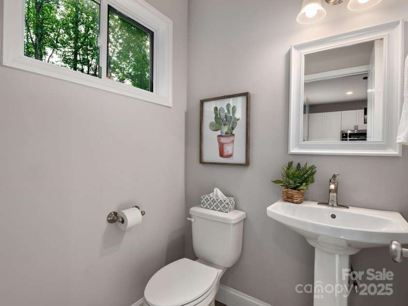 111 Mears Ridge Drive, Asheville, NC 28806.  MLS# CAR4265315, YatesRealty ID 32084. Convenient half bathroom on main level