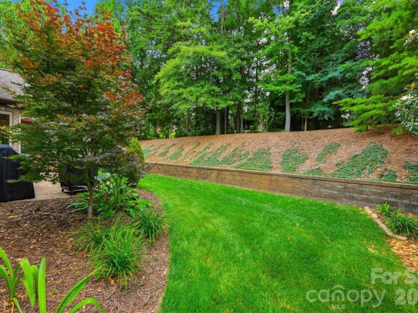 8094 Clems Branch Road, Indian Land, SC 29707.  MLS# CAR4388954, YatesRealty ID 32089. Backyard extends beyond top of hill