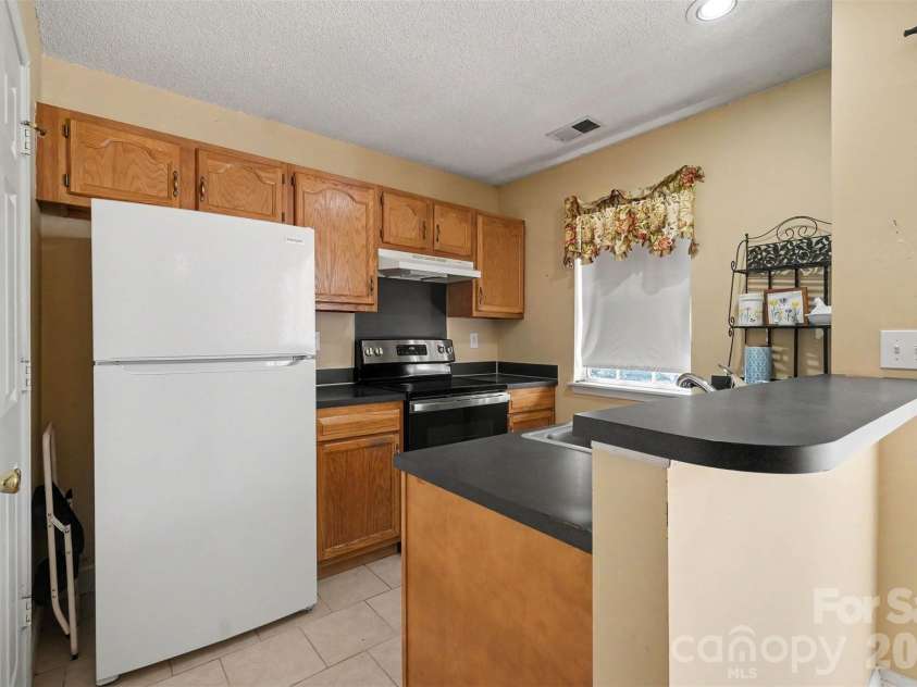 9132 Charminster Court, Charlotte, NC 28269.  MLS# CAR4394963, YatesRealty ID 32090. 