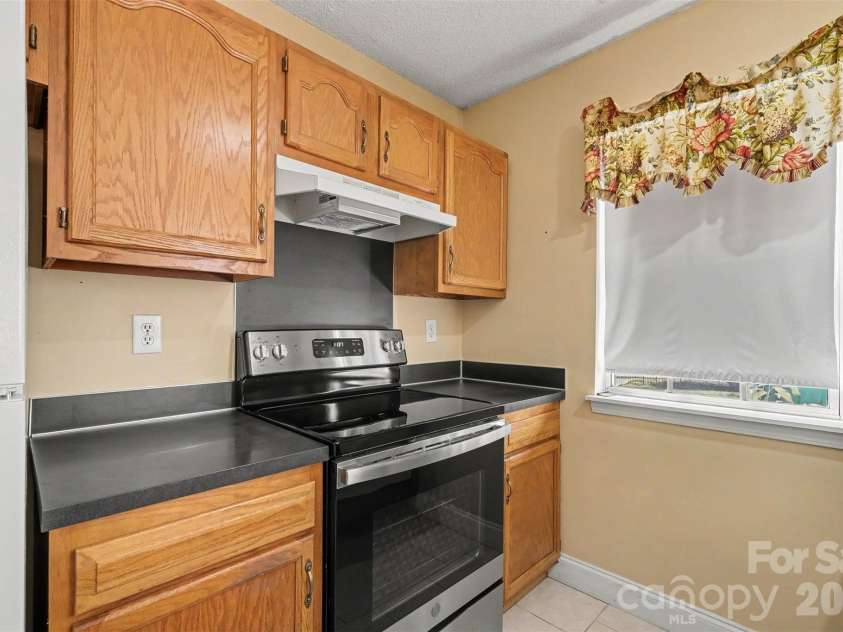 9132 Charminster Court, Charlotte, NC 28269.  MLS# CAR4394963, YatesRealty ID 32090. 