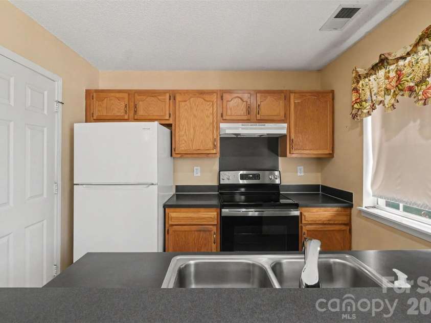 9132 Charminster Court, Charlotte, NC 28269.  MLS# CAR4394963, YatesRealty ID 32090. 