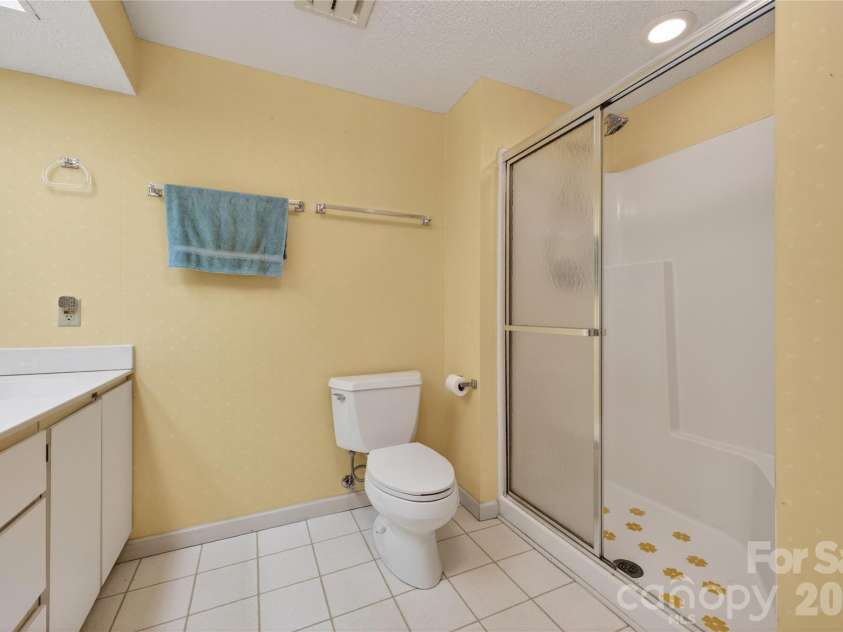 118 Gagama Court, Brevard, NC 28712.  MLS# CAR4369667, YatesRealty ID 32094. Downstairs bath
