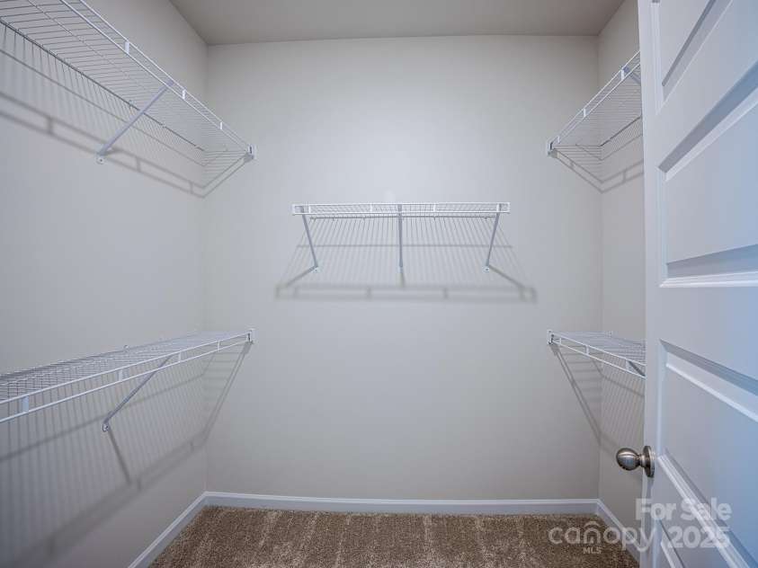 2511 Ruby Dixon Crossing Drive, Gastonia, NC 28056.  MLS# CAR4278229, YatesRealty ID 32094. Primary closet - Photo is representational