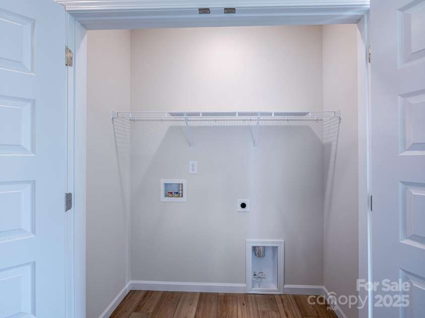 2511 Ruby Dixon Crossing Drive, Gastonia, NC 28056.  MLS# CAR4278229, YatesRealty ID 32094. Upstairs laundry - Photo is representational