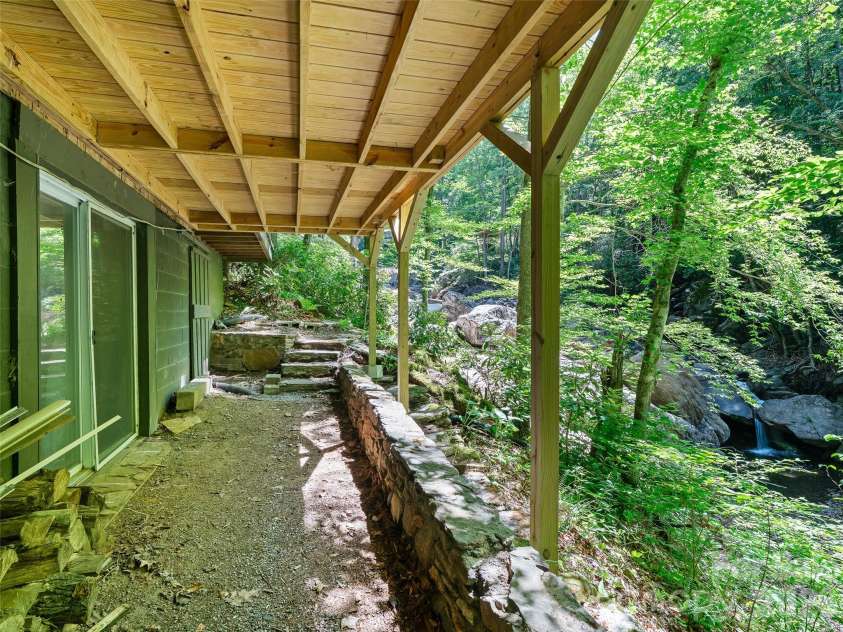 552 Fork Road, Burnsville, NC 28714.  MLS# CAR4395564, YatesRealty ID 32097. LOwer cover outside Living room on bottom level 