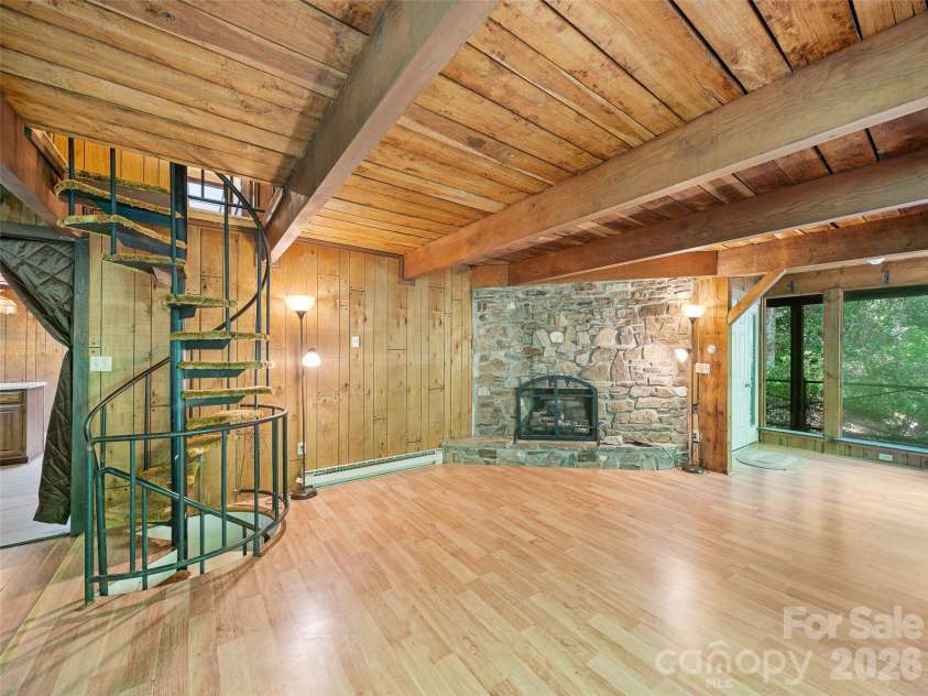 552 Fork Road, Burnsville, NC 28714.  MLS# CAR4395564, YatesRealty ID 32097. Spiral staircase access to upper level and basement level