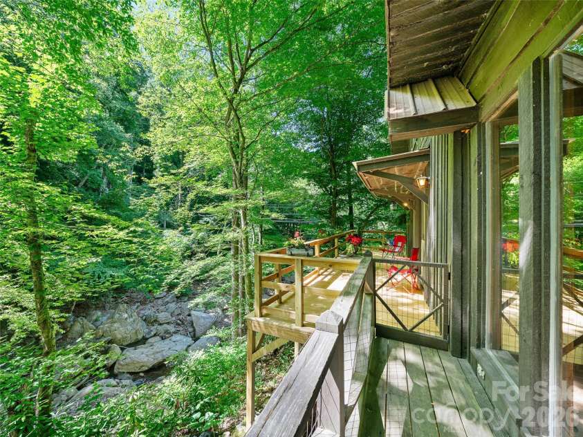 552 Fork Road, Burnsville, NC 28714.  MLS# CAR4395564, YatesRealty ID 32097. Wooded Oasis --mild temps in summer 