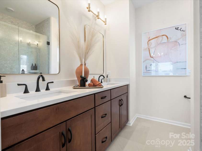 5636 Kingspan Drive, Charlotte, NC 28217.  MLS# CAR4211544, YatesRealty ID 32097. Roan Model Home Primary Bath | Southmont *actual finishes, color scheme, orientation vary on this home. Furniture not included