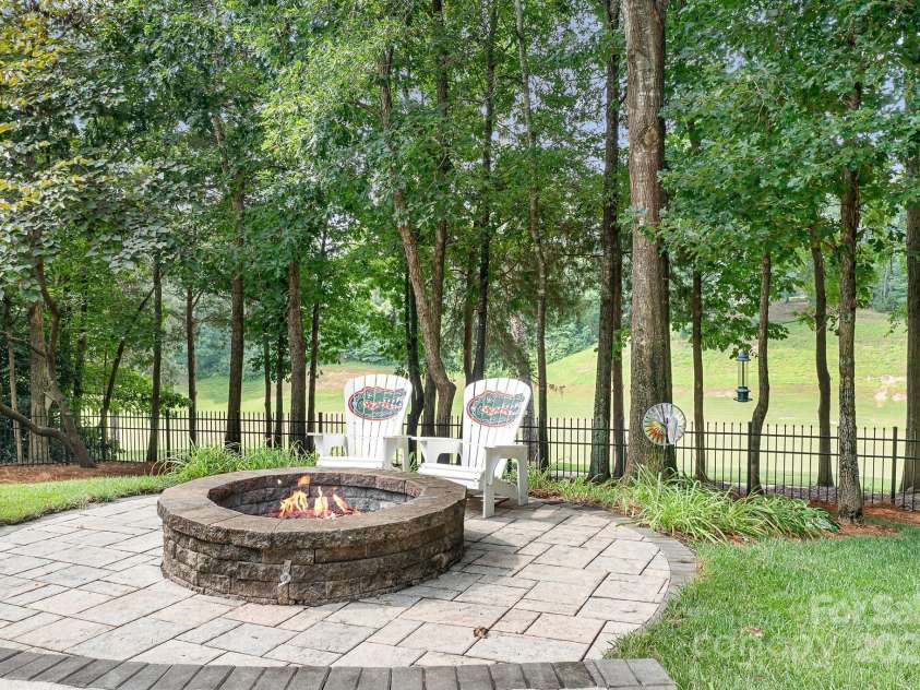 14138 Timbergreen Drive, Huntersville, NC 28078.  MLS# CAR4277542, YatesRealty ID 32099. Firepit overlooking the course