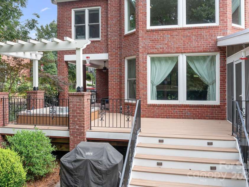 14138 Timbergreen Drive, Huntersville, NC 28078.  MLS# CAR4277542, YatesRealty ID 32099. Hot Tub built into porch