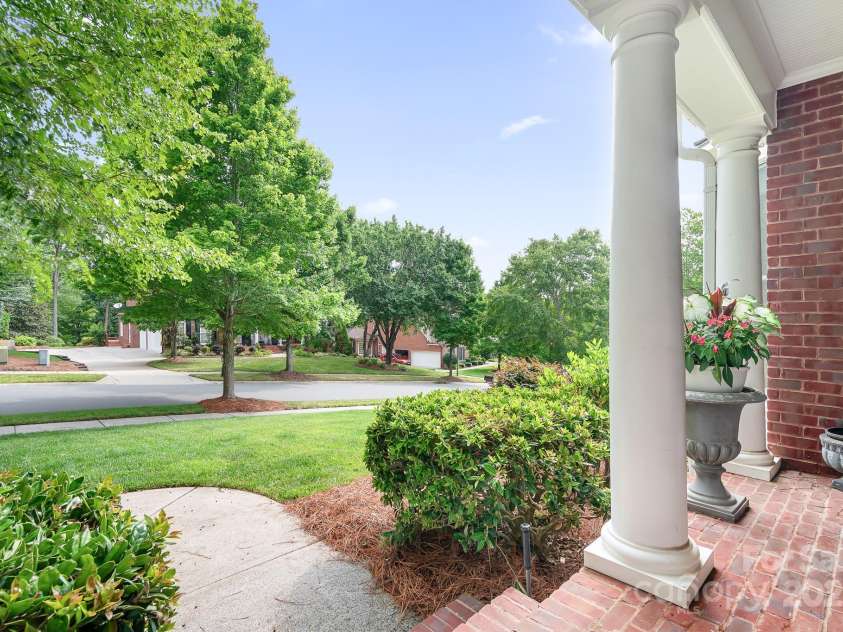 14138 Timbergreen Drive, Huntersville, NC 28078.  MLS# CAR4277542, YatesRealty ID 32099. Porch with room for rockers