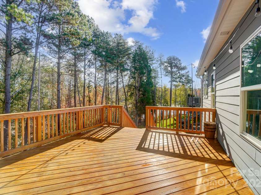 25622 Seagull Drive, Lancaster, SC 29720.  MLS# CAR4197306, YatesRealty ID 3210. Deck with view of the canopy trees and lake