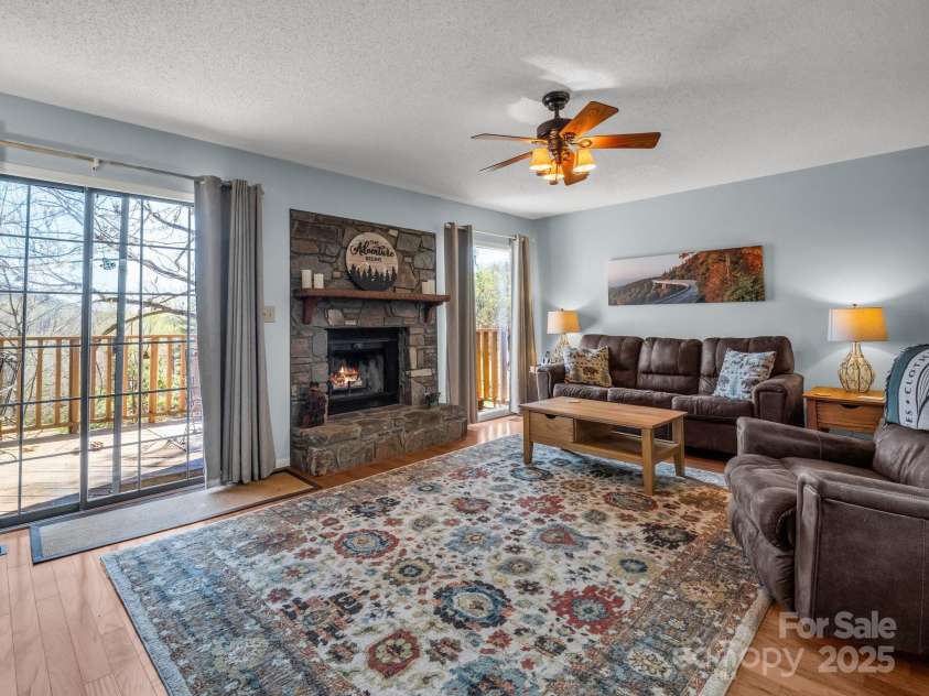 110 Appledore Court, Lake Lure, NC 28746.  MLS# CAR4239274, YatesRealty ID 3212. Living room with fireplace