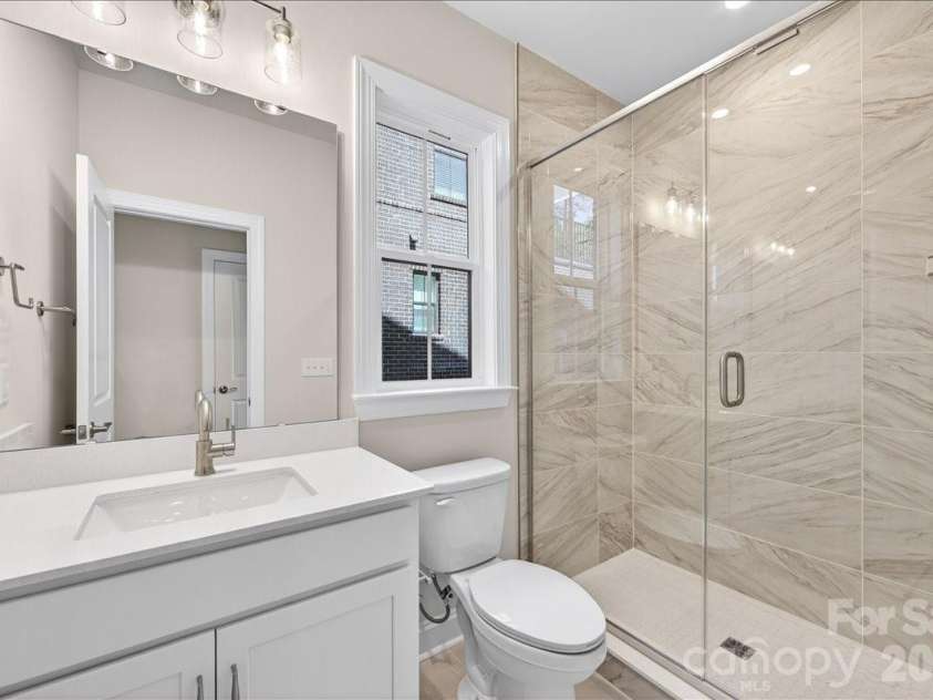 12015 Elsa Lane, Charlotte, NC 28277.  MLS# CAR4396074, YatesRealty ID 32126. First floor GenSmart full bathroom