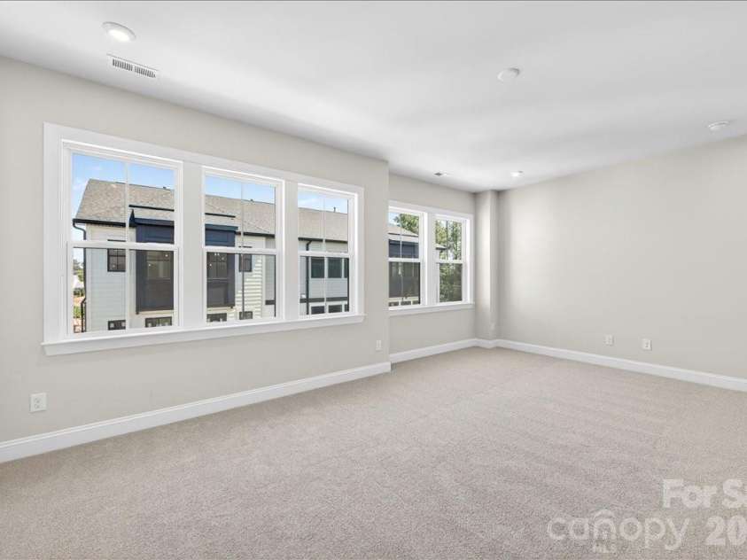 12015 Elsa Lane, Charlotte, NC 28277.  MLS# CAR4396074, YatesRealty ID 32126. Primary Bedroom with ample windows for natural light