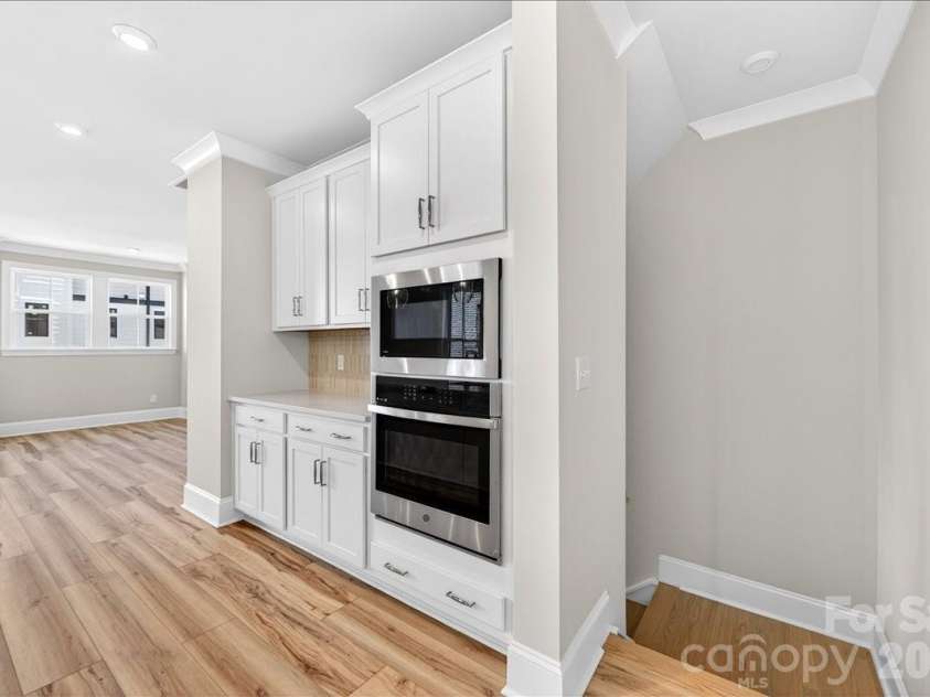 12015 Elsa Lane, Charlotte, NC 28277.  MLS# CAR4396074, YatesRealty ID 32126. Second floor landing into the gourmet kitchen