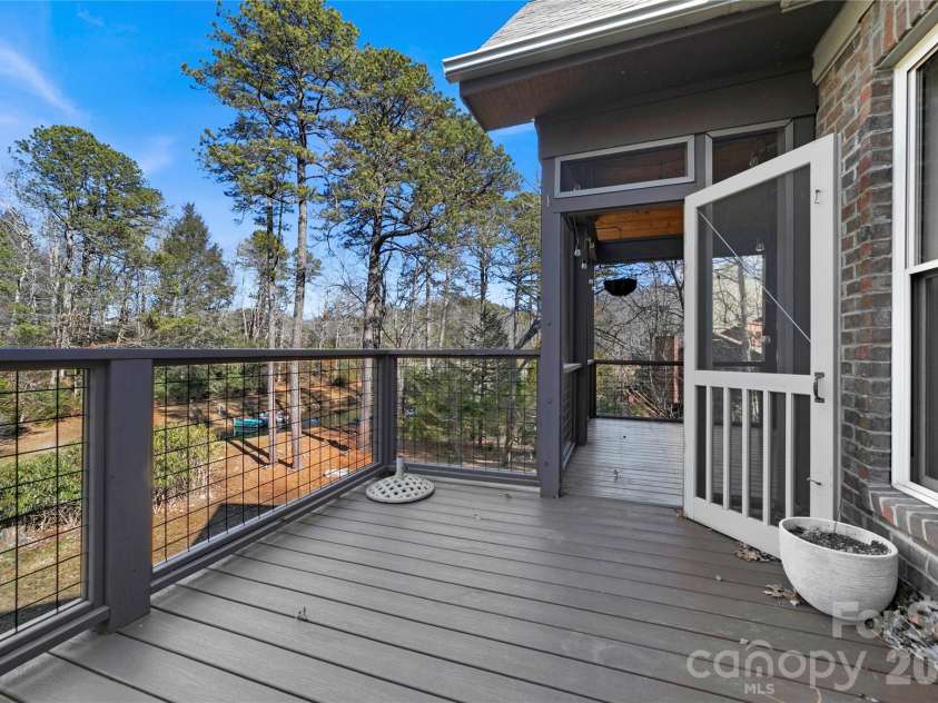 886 Soquili Drive, Brevard, NC 28712.  MLS# CAR4316756, YatesRealty ID 3213. Grilling deck overlooking back yard