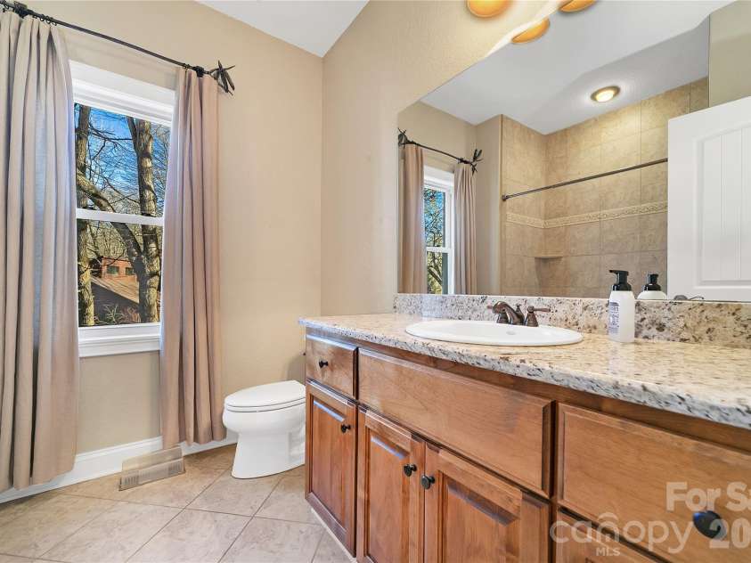 886 Soquili Drive, Brevard, NC 28712.  MLS# CAR4316756, YatesRealty ID 3213. Guest bath for guest suite