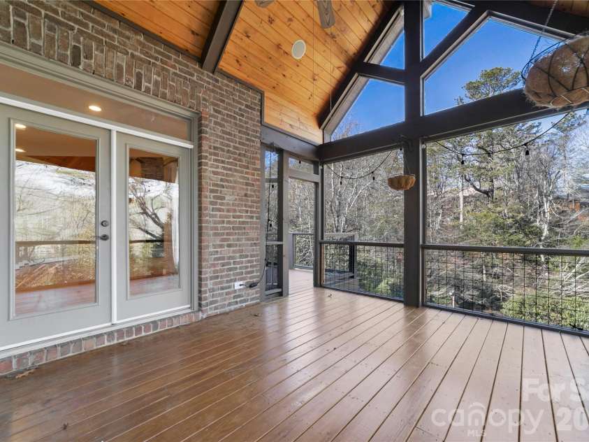 886 Soquili Drive, Brevard, NC 28712.  MLS# CAR4316756, YatesRealty ID 3213. Spacious screen porch