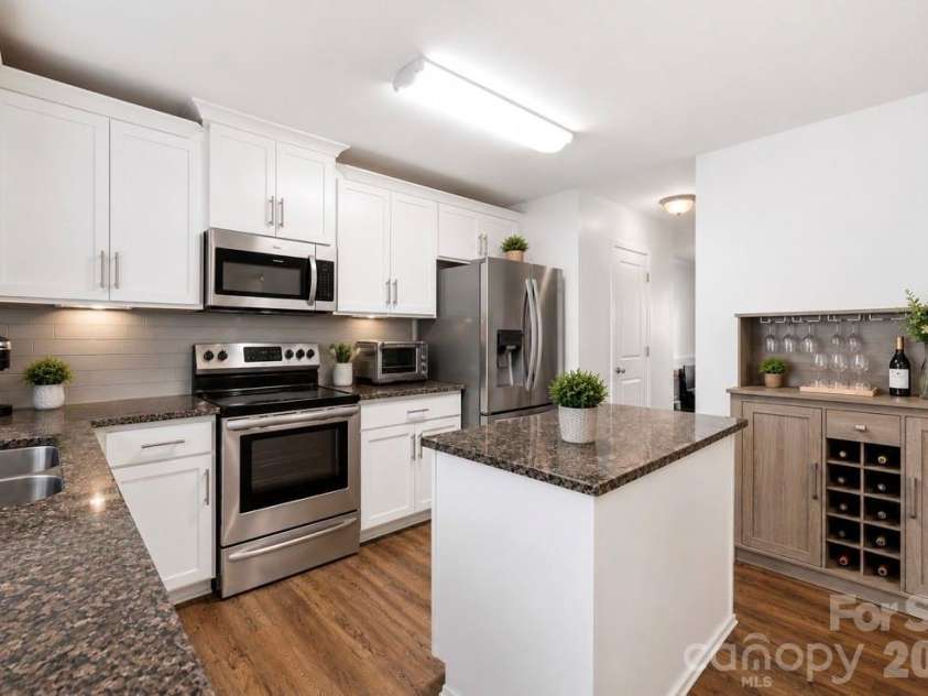 8502 Mansell Court, Charlotte, NC 28215.  MLS# CAR4395611, YatesRealty ID 32130. “Virtually staged using AI. No structural changes have been made.“