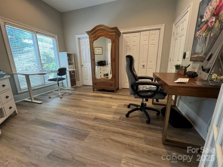 17709 Sedona Way, Cornelius, NC 28031.  MLS# CAR4274595, YatesRealty ID 32132. Guest Bedroom 1 has Recessed Lights and Fan/Light Combo, Large Closet, Double Doors, New LVP Flooring with, & Access to a Full Bath.  It is currently being used as a home office!