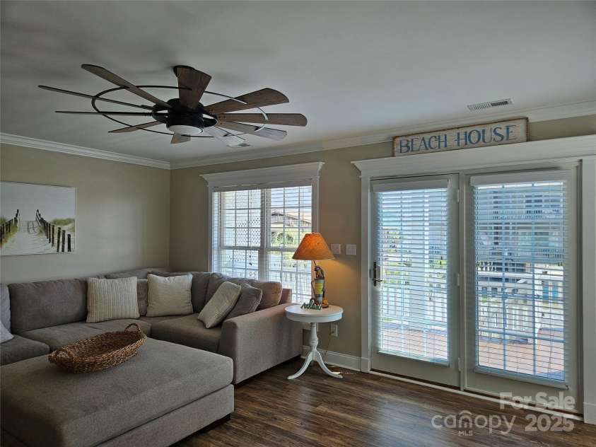 281 Brunswick Avenue, Holden Beach, NC 28462.  MLS# CAR4289276, YatesRealty ID 32135. Family Room Exterior Doors to Covered Deck