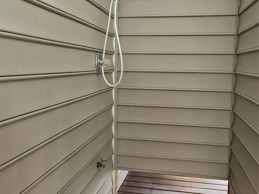 281 Brunswick Avenue, Holden Beach, NC 28462.  MLS# CAR4289276, YatesRealty ID 32135. Outside Shower