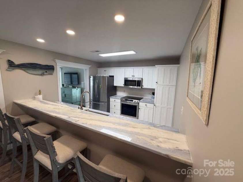281 Brunswick Avenue, Holden Beach, NC 28462.  MLS# CAR4289276, YatesRealty ID 32135. Refrigerator Range & Pantry