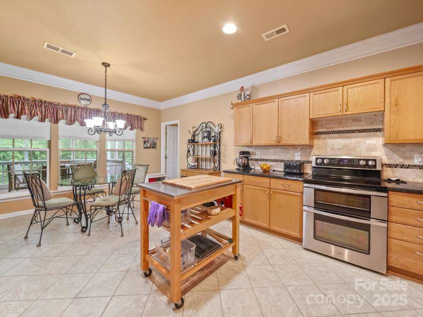 9002 Fenwick Drive, Indian Trail, NC 28079.  MLS# CAR4287627, YatesRealty ID 32142. Kitchen & Dining Area