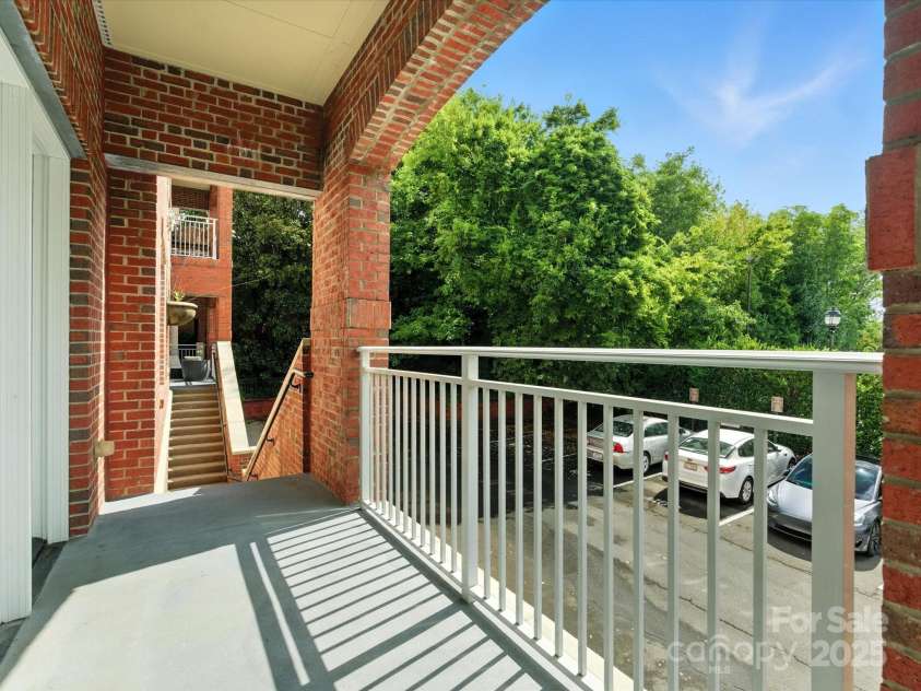 1829 Kenilworth Avenue, Charlotte, NC 28203.  MLS# CAR4270510, YatesRealty ID 32147. Patio with stairs to Parking area