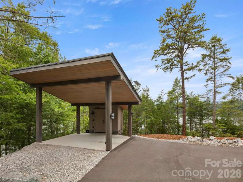 425 Dockside Drive, Nebo, NC 28761.  MLS# CAR4393009, YatesRealty ID 32158. Carport by garage for additional parking.