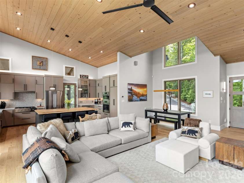 425 Dockside Drive, Nebo, NC 28761.  MLS# CAR4393009, YatesRealty ID 32158. Living room, dining area and kitchen.