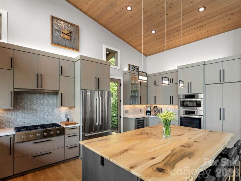 425 Dockside Drive, Nebo, NC 28761.  MLS# CAR4393009, YatesRealty ID 32158. Oversized live-edge white Oak island top.