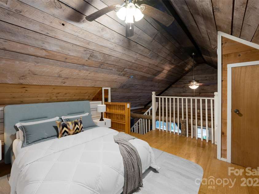 49 & 51 Mayapple Lane, Brevard, NC 28712.  MLS# CAR4288314, YatesRealty ID 32158. Virtually staged loft bedroom